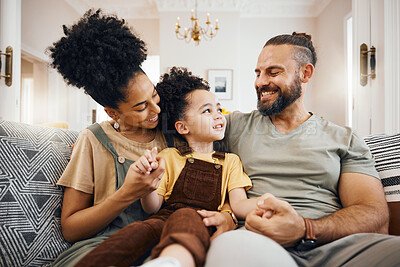 Buy stock photo Smile, bonding and interracial family on the sofa for conversation, love and talking. Happy, house and a mother, father and a boy child on the couch for comfort, care and together for communication