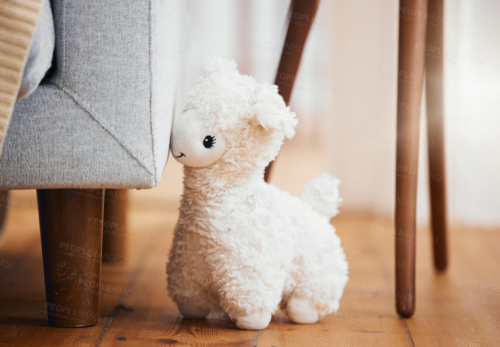 Buy stock photo Teddy bear, empty room and toy on floor of home, background and alone by sofa in lounge of house. Abandoned, lonely and stuffed animal for grief, mental health, loss and sad or security by couch