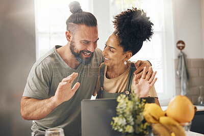 Buy stock photo Interracial couple, video call and happy with laptop, wave hello and smile in kitchen, home and web chat. Excited man, young woman and contact with computer, webinar and talking with app in apartment