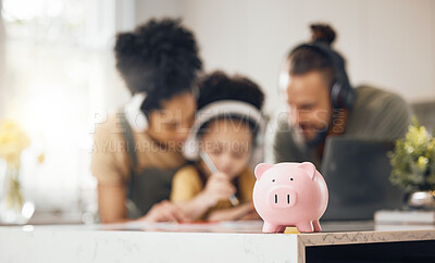 Buy stock photo Piggy bank, table and parents with kid, learning or writing with headphones, online course or saving advice. Mom, dad and child for education, investment or help for future in interracial family home