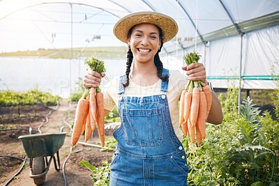 Buy stock photo Farming, portrait of happy woman holding carrots at sustainable small business in agriculture and natural organic food. Girl working at agro greenhouse, vegetable growth and eco friendly with smile.