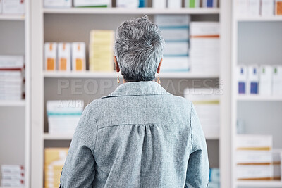 Buy stock photo Back, senior woman and pharmacy, shopping for pills with dispensary, sick and health with wellness. Medicine, antibiotic for healthcare and search shelf, pharmaceutical drugs and patient in drugstore