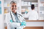 Senior, woman and doctor, portrait with arms crossed and healthcare, medical professional and hospital dispensary. Pharmacy, health and confidence, smile with wellness and drugs, medicine and service