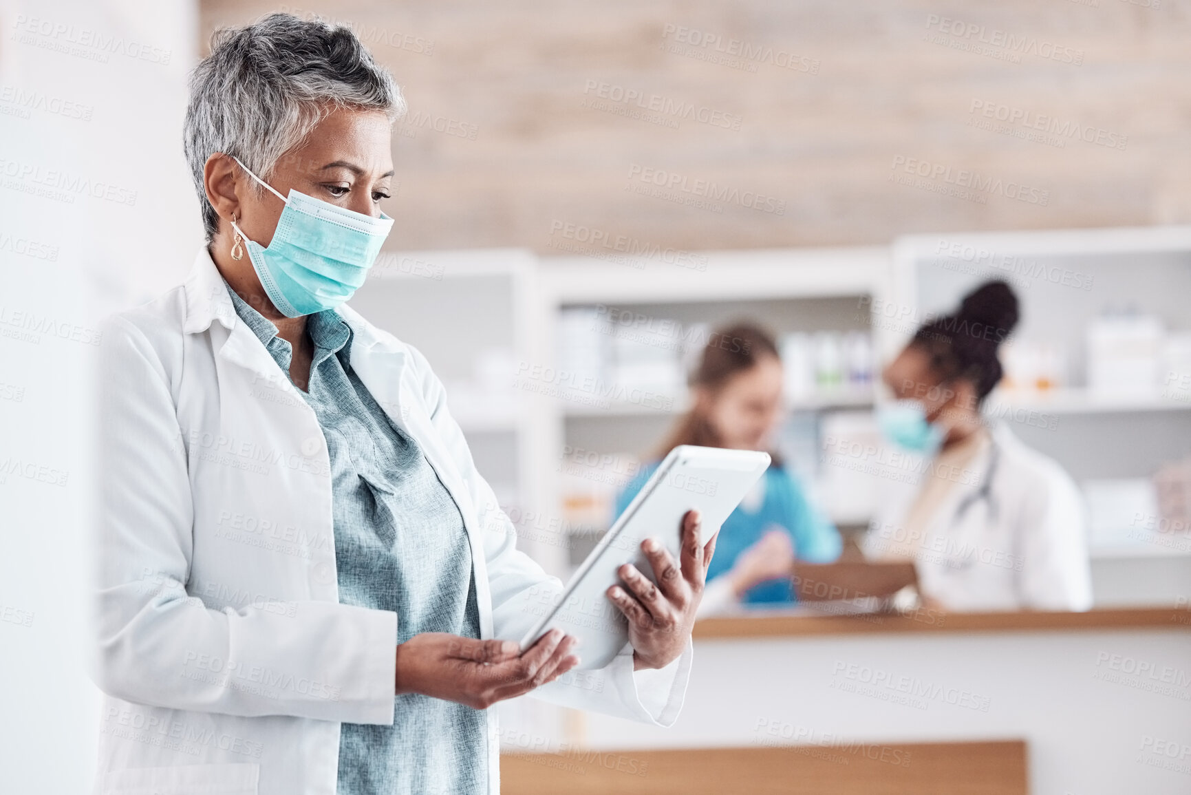 Buy stock photo Hospital, doctor and woman with tablet, connection and network with telehealth, search internet and email notification. Person, medical professional and surgeon with technology, mask and research