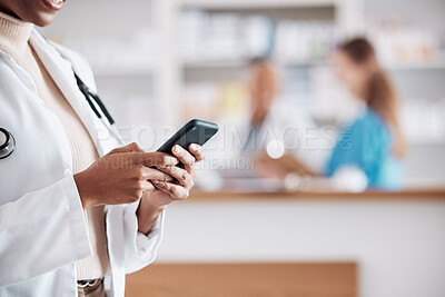 Buy stock photo Woman pharmacist with phone, typing in clinic and research for medical information, email or online chat. Smartphone, networking and mockup, doctor in pharmacy checking social media or internet news 