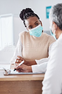 Buy stock photo Face mask, doctor or nurse consulting a patient in meeting in hospital writing history or healthcare record. People, medical or nurse with black woman talking or speaking of test results or advice 