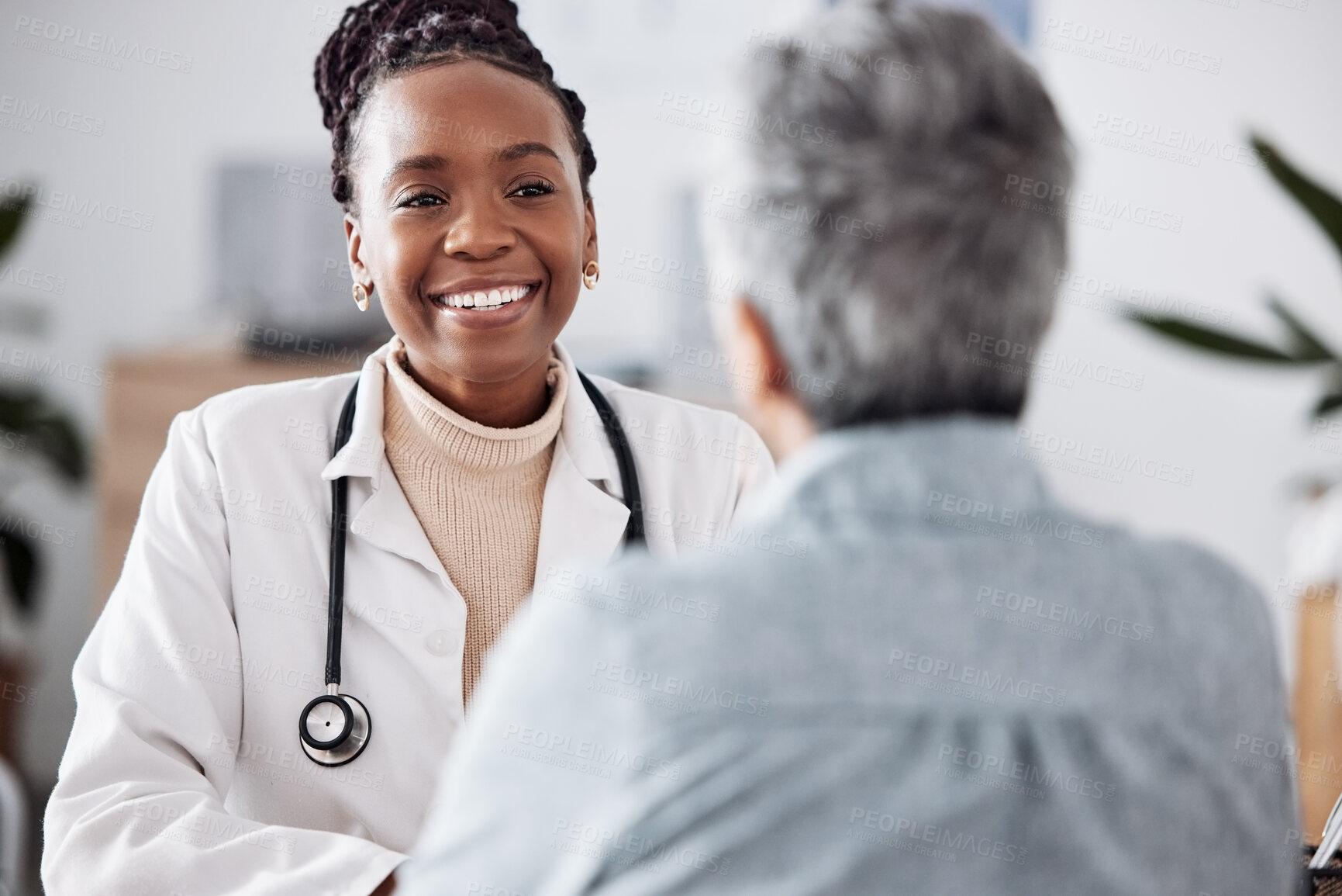Buy stock photo Happy, black woman or doctor consulting a patient in meeting in hospital for healthcare feedback or support. Smile, medical or nurse with a mature person talking or speaking of test results or advice