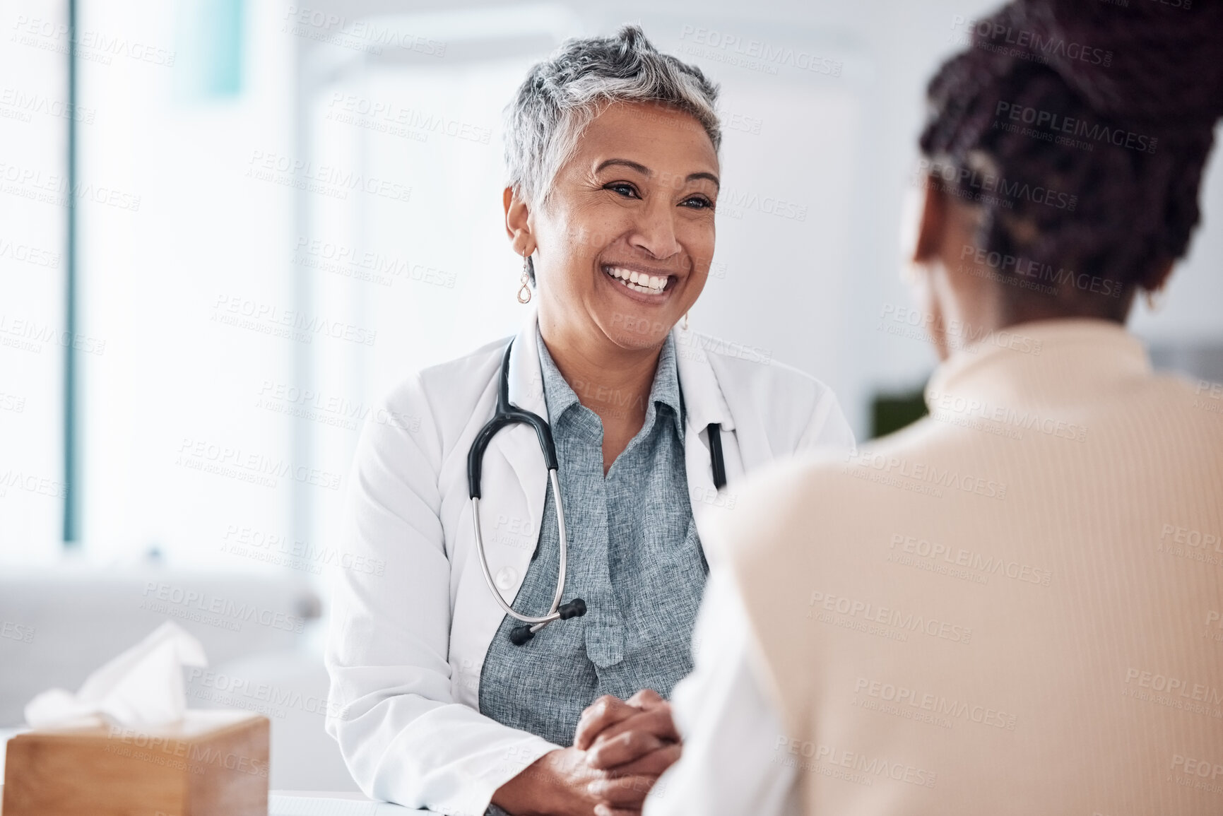 Buy stock photo Happy, mature or doctor consulting a patient in meeting in hospital for healthcare help, feedback or support. People, medical or nurse with black woman talking or speaking of test results or advice 