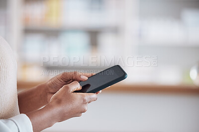 Buy stock photo Woman pharmacist with smartphone, typing in clinic and research for medical information, email or online chat. Phone, networking and mockup, doctor in pharmacy checking social media or internet news 