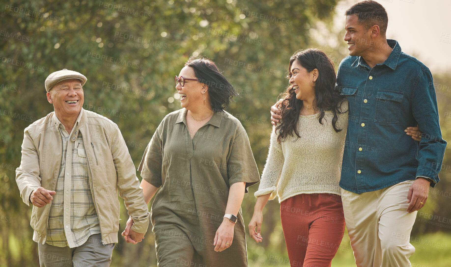 Buy stock photo Love, walking and happy with big family in park for bonding, support and summer. Vacation, happiness and holiday with people relax in grass field in nature for peace, generations or care together