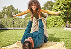 Father, kid and plane game in park, outdoor or nature on holiday, freedom or care for bonding. Excited young child, dad and lift for airplane, smile or free for play on vacation in portrait on ground