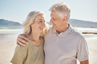 Buy stock photo Senior couple, smile and outdoor at the beach with happiness, freedom and care on vacation. Man and woman on retirement holiday, adventure and romantic trip in nature to relax and travel with love
