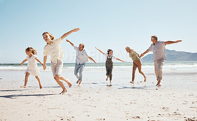 Buy stock photo Running, freedom and family on beach, airplane and game with travel and fun, grandparents with parents and kids outdoor. Playful, energy and playing together, ocean and care free on tropical vacation