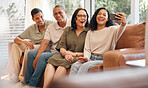 Happy family, sofa and selfie laughing in photography, memory or holiday weekend and bonding together at home. Couple and parents smile for photograph, picture or social media on living room couch