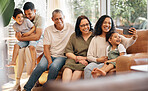 Happy family, selfie and grandparents and children on sofa for holiday, love and relax together at home. Interracial people, mother and father with kids in living room, profile picture or photography