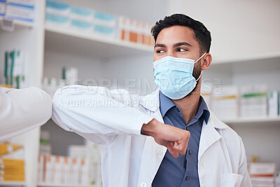 Buy stock photo Man, elbow greeting and pharmacist with healthcare, social distancing or covid regulations. Person, medical professional or employee with protection, mask or greet with pandemic policy in a workplace
