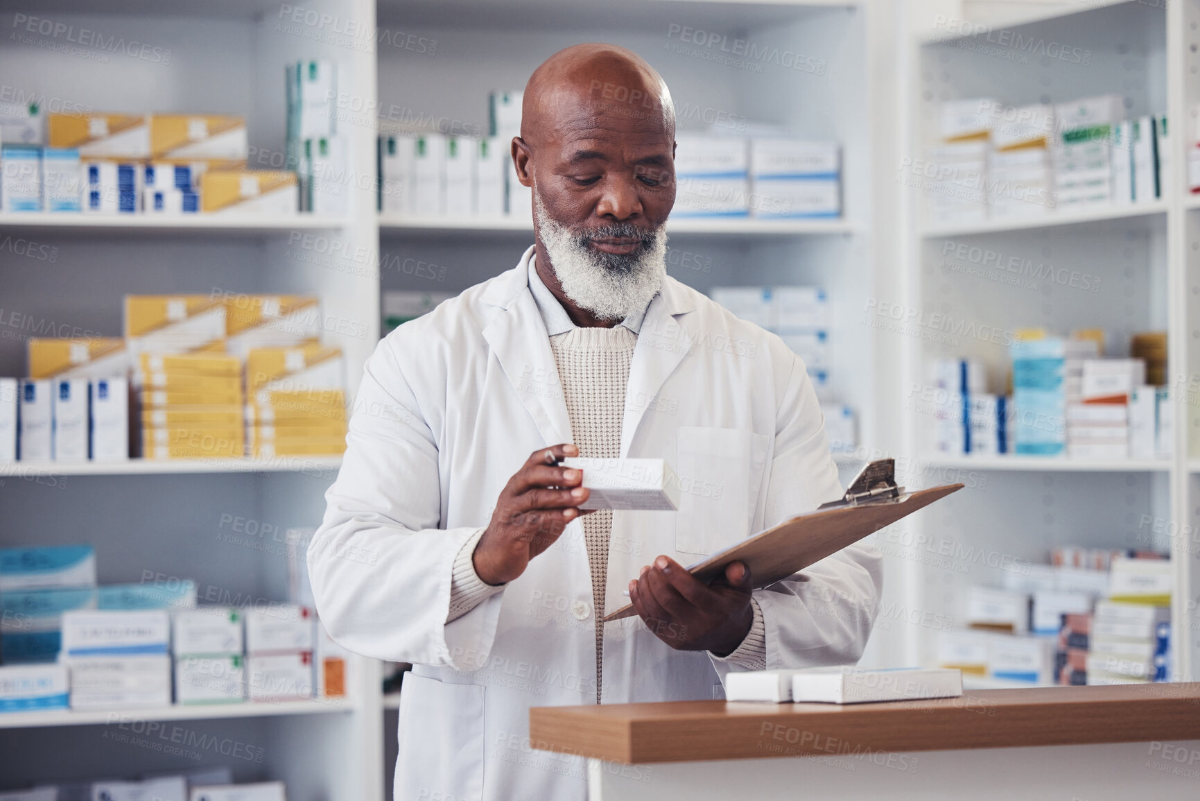 Buy stock photo Pharmacy medicine, clipboard and mature black man reading product description, package info or checklist for clinic inventory. List, medical pills box and pharmacist check pharmaceutical supplements