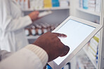 Typing, pharmacy and hands with a tablet for a search, check of stock or medicine update online. Closeup, connection and medical employee on technology for healthcare inventory or website at a clinic