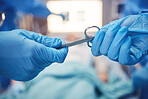 Hands, scissors for operation and teamwork in the hospital during surgery or emergency medical procedure. Collaboration, healthcare equipment and doctors in theatre together to save a patient closeup