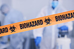 Biohazard, tape and people with caution working with toxic, biology or team disinfect dangerous bacteria or for health crisis. Hazard, protection and warning for bio safety or cleaning in hazmat suit