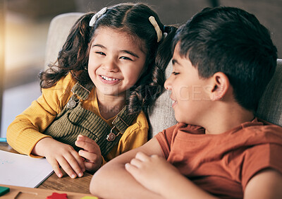 Buy stock photo Girl, boy and siblings in home, learning and smile with book, toys and education at desk for development. Happy family, children and together with notebook, studying and playful with bonding in house