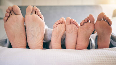 Buy stock photo Family feet, bed and closeup with kid to relax with love, rest and sleeping on hotel mattress for vacation. Parents, sleep and bedroom with child, mom and father for bonding, care and safe in house