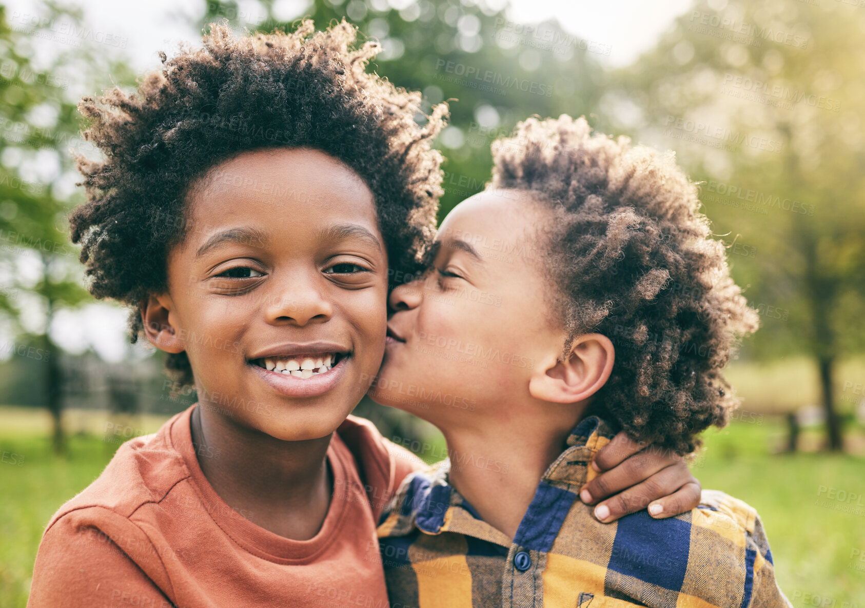Buy stock photo Portrait, kids and boy siblings kiss in a park for play, fun and bonding in nature together. Family, face and brothers hug, African children and happy outdoor with love, support and trust on weekend