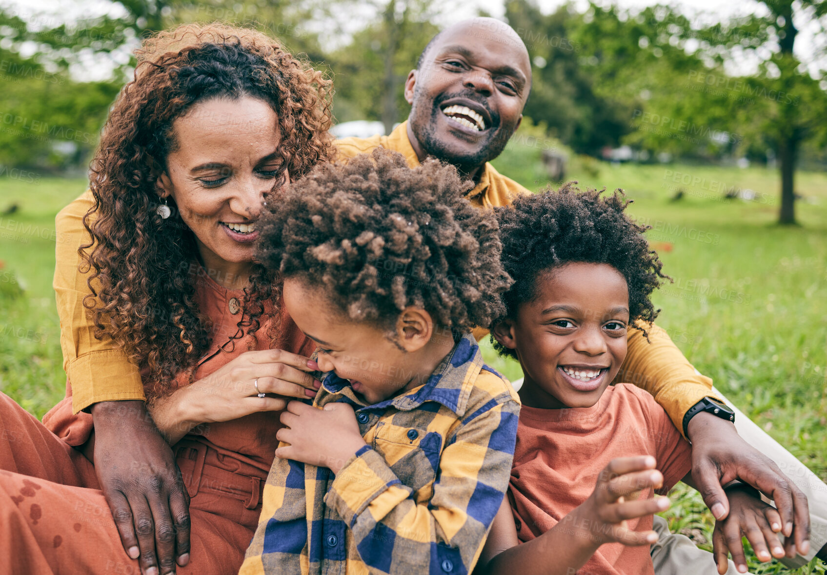 Buy stock photo Happy black family, parents and children in a park in summer, smile and relax on grass field for love and fun in nature. Happiness, picnic and portrait of African people outdoor and playing together