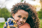 Portrait, kid and hug mother in nature, happy and bonding together outdoor. Face, mom and African child embrace in connection for healthy relationship, family smile and trust for care in love support