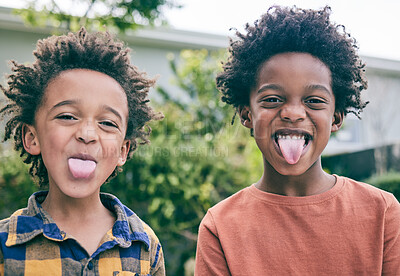 Buy stock photo Children, portrait and brothers with tongue out in a backyard for fun, playing and sibling bonding outdoor. Family, love and kids with funny face, emoji and silly together in a garden on the weekend