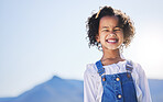 Happy girl, portrait and smile on mockup space for holiday, summer vacation or outdoor weekend in nature. Face of female person, kid or child in happiness for travel, trip or day in the countryside