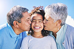 Happy, sky or grandparents kiss child bonding in Brazil to relax with love, smile or care in retirement. Face, proud elderly grandmother or senior grandfather with kid on holiday vacation in summer