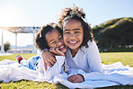 Portrait, family and a girl with her sister on the grass outdoor of their home together in summer. Face, smile and sibling children hugging on a field while happy about travel, vacation or holiday