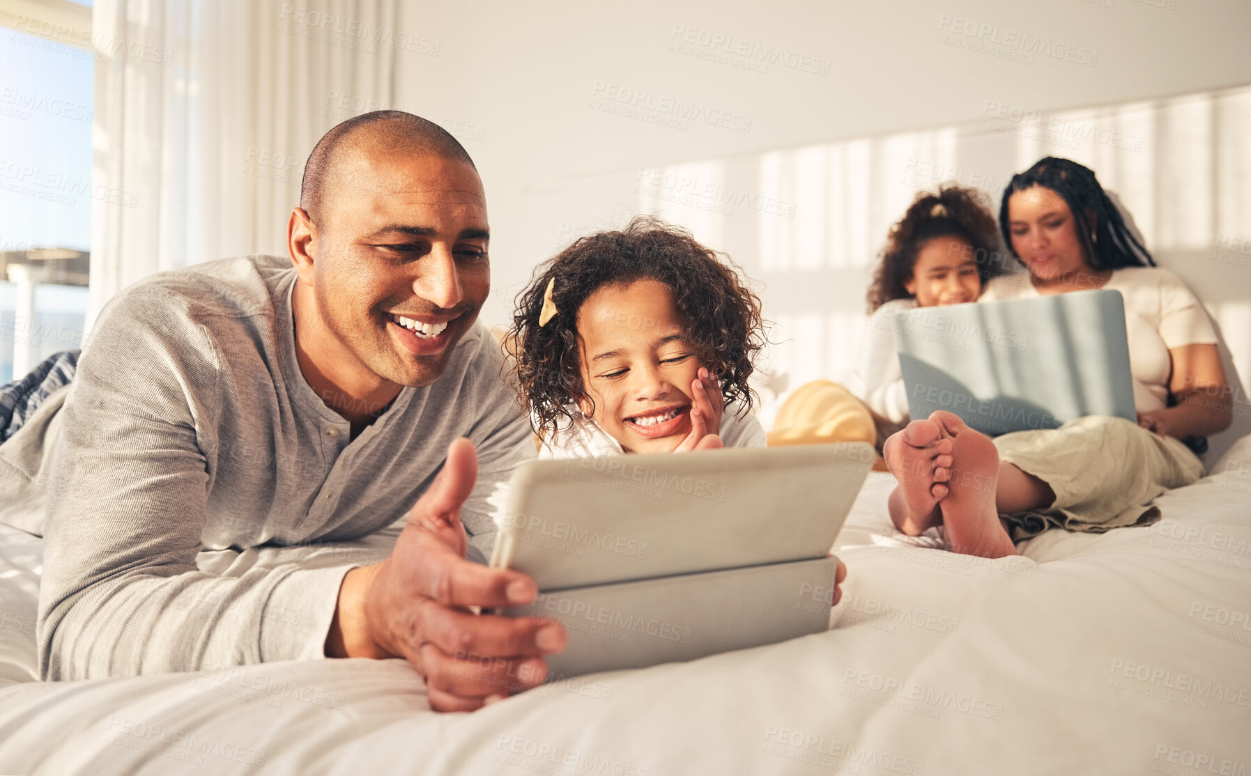 Buy stock photo Relax, family and technology in the bedroom for movies, cartoon or education on the internet. Happy, together and parents with girl kids and a laptop and tablet for streaming a show, film or games