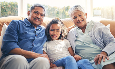 Buy stock photo Grandparents, portrait and happy child on sofa in home living room, bonding and having fun together. Smile, grandma and grandfather with kid in lounge to relax with love, care and family connection