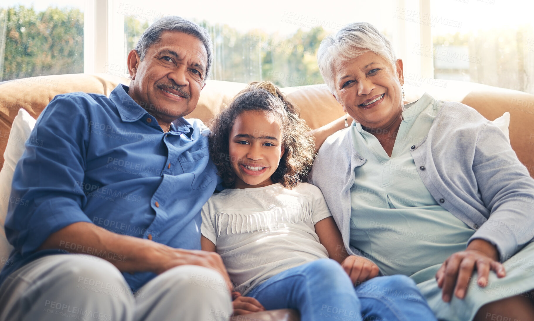 Buy stock photo Grandparents, portrait and happy child on sofa in home living room, bonding and having fun together. Smile, grandma and grandfather with kid in lounge to relax with love, care and family connection