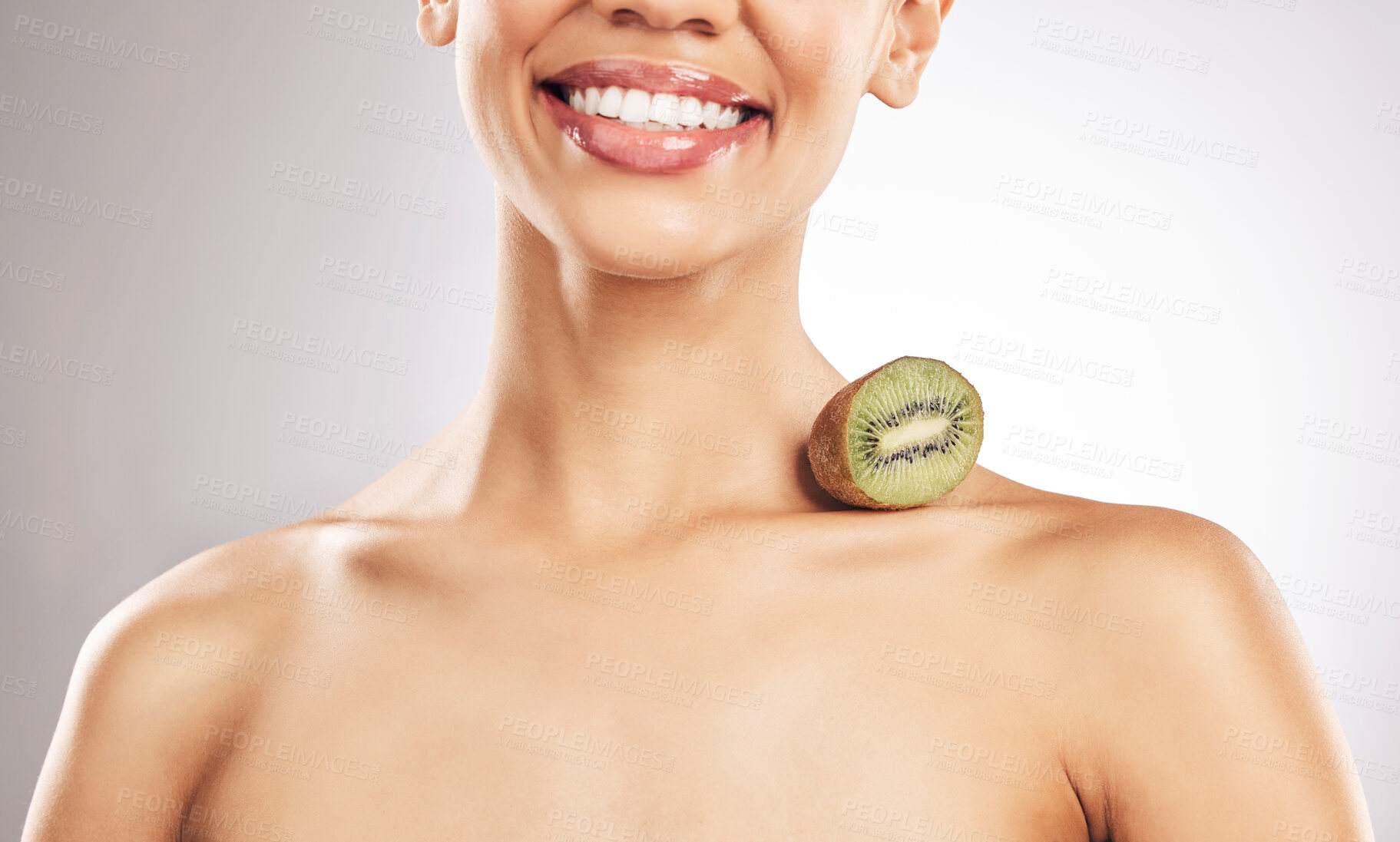 Buy stock photo Skincare, kiwi and woman in studio smile for natural, beauty or treatment or eco friendly cosmetics on white background. Wellness, skin and female model with fruit for collagen, detox or vitamin C