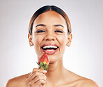 Skincare, portrait and happy woman with strawberry in studio for wellness or natural cosmetics on white background. Beauty, face and female smile with fruit for antioxidants or anti aging wellness