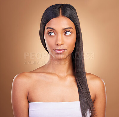 Buy stock photo Keratin, hair care and skincare with face of woman in studio for beauty, salon treatment and texture. Shampoo, health and thinking with model on brown background for glamour, shine and hairstyle