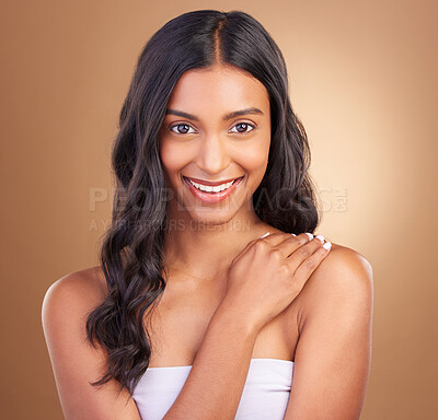 Buy stock photo Portrait, hair care and woman with a smile, cosmetics and wellness on a brown studio background. Face, person and model with shine, luxury and aesthetic with dermatology, shampoo and natural beauty