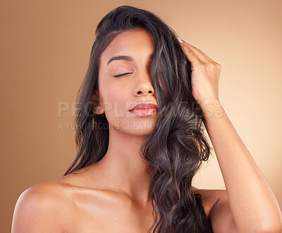 Buy stock photo Portrait, hair care and woman with a shine, beauty and luxury treatment on a brown studio background. Face, person and model with glow, wellness and aesthetic with dermatology, shampoo and cosmetics