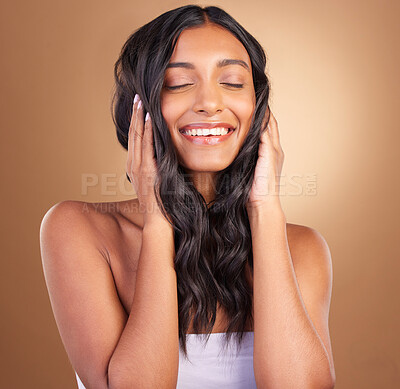 Buy stock photo Portrait, hair care and woman with a smile, volume and wellness on a brown studio background. Face, person and model with shine, texture and aesthetic with dermatology, shampoo or cosmetics with glow