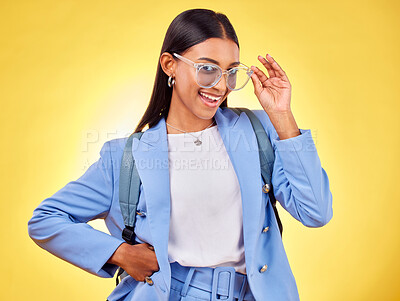 Buy stock photo Fashion, student or portrait of woman in sunglasses on yellow background with trendy clothes or smile. Girl, happy person and excited gen z model with cool style, bag or elegant outfit in studio