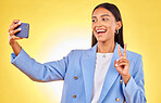 Business woman, selfie and peace sign in studio, smile or excited for review, post or blog by yellow background. Entrepreneur, icon or happy for memory, photography or profile picture on social media
