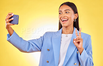 Buy stock photo Business woman, selfie and peace sign in studio, smile or excited for review, post or blog by yellow background. Entrepreneur, icon or happy for memory, photography or profile picture on social media
