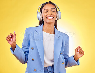 Buy stock photo Dance, relax or happy woman streaming music in headphones on yellow background. Relax, smile or calm entrepreneur listening to radio song, album or audio sound on subscription playlist in studio