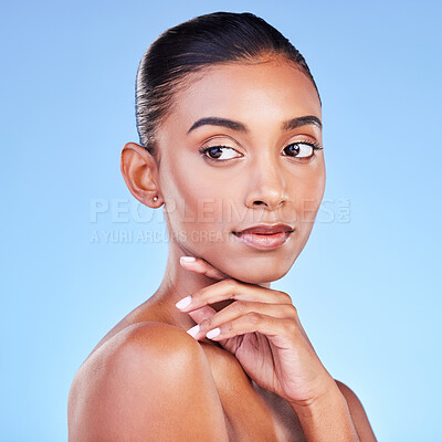 Buy stock photo Beauty, dermatology and skincare with face of woman in studio for cosmetics, health and facial. Glow, self care and wellness with person on blue background for spa treatment, grooming and makeup