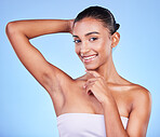 Armpit, epilation and woman in portrait with beauty, grooming and smile isolated on blue background. Hygiene, cleaning body and hair removal with skincare, cosmetics and dermatology in a studio