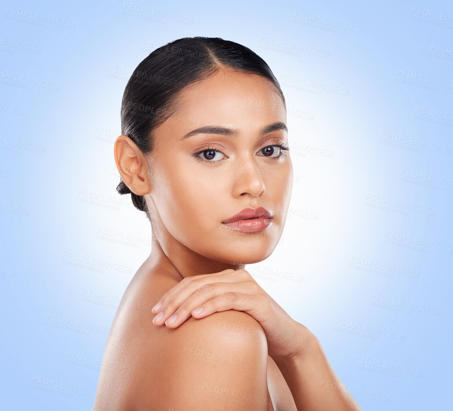 Buy stock photo Portrait, glow and a woman with skincare on a blue background for wellness, beauty and health. Moisture, natural and a girl or model touching skin for cosmetics, dermatology or grooming on a backdrop