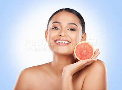 Buy stock photo Beauty skincare, portrait and happy woman with grapefruit treatment results, natural self care or fruit benefits. Vitamin C product, eco friendly cosmetics or studio face of person on blue background